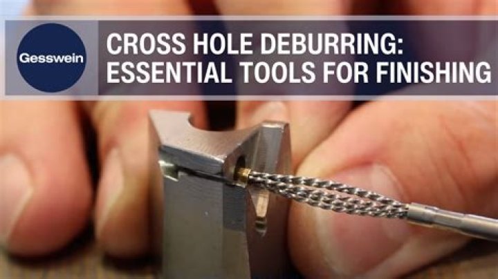 Which tool is used to finish a drilled hole manually?