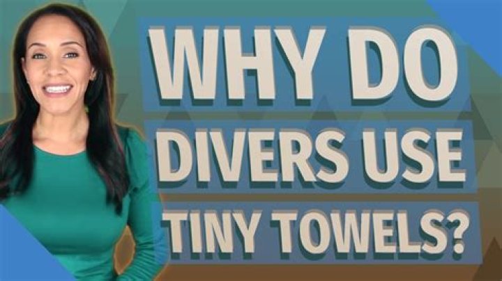 Why do divers hit themselves with towels?
